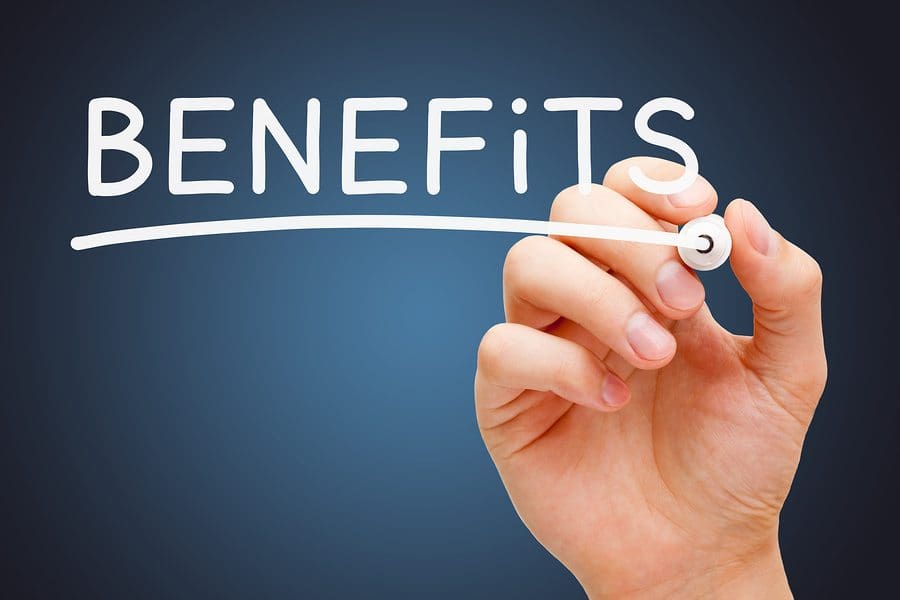 Hand writing Benefits with white marker on transparent wipe board.